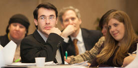 Male orthodox student smiling in class